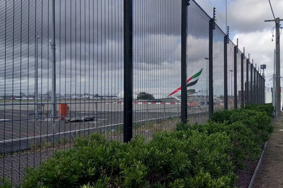 Black 358 high security fence with barbed wire are installed in the airport