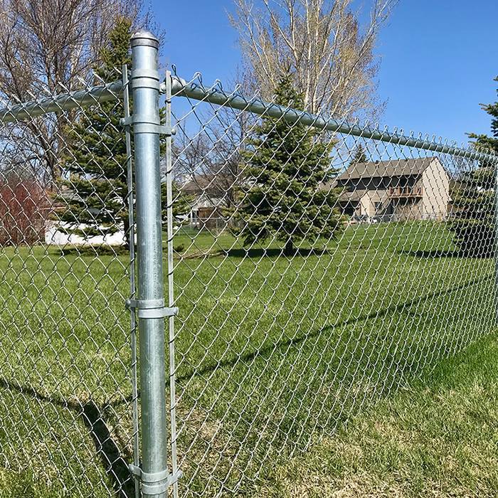 The chain link fence is used to set boundaries for gardens.