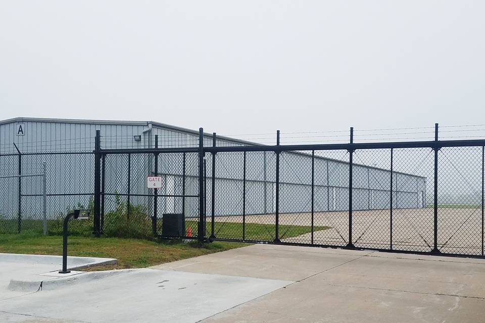 The workshop is encircled by chain link fence.