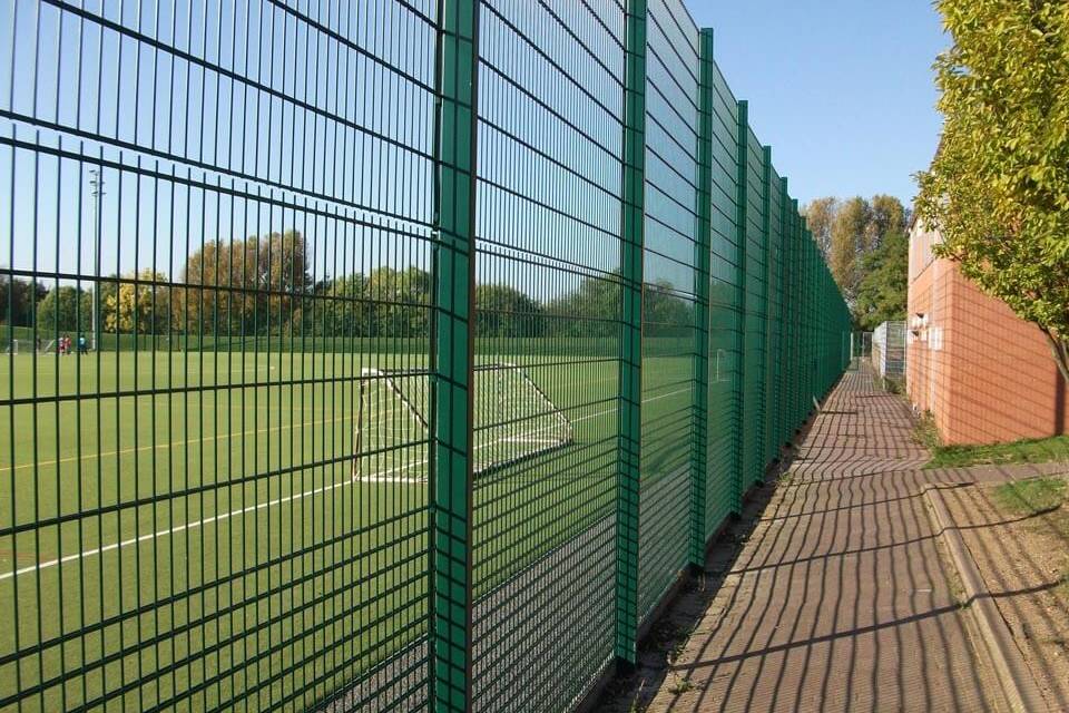 Double wire fence is installed round the football field.