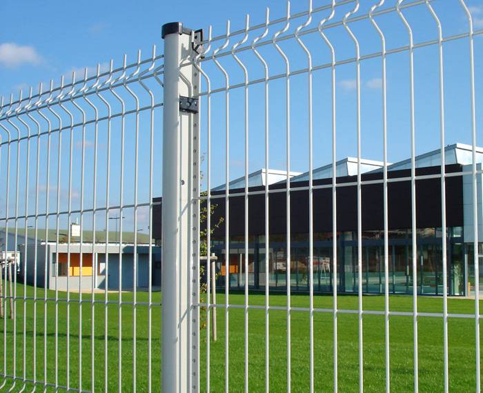 A line of steel fence is installed in the industrial zone.