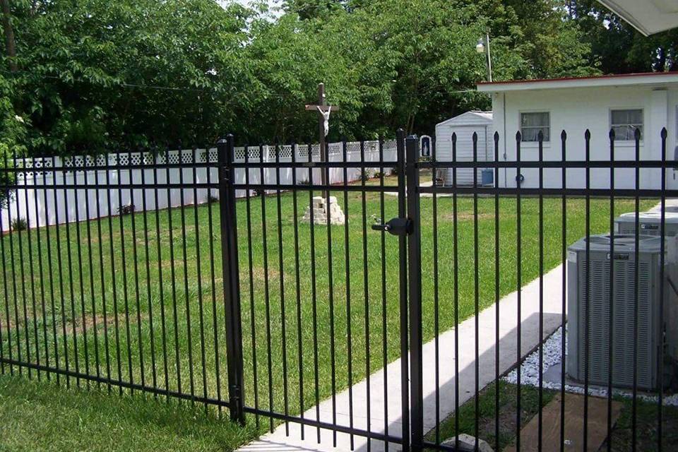 A private house is enclosed by steel fence with a fence gate.