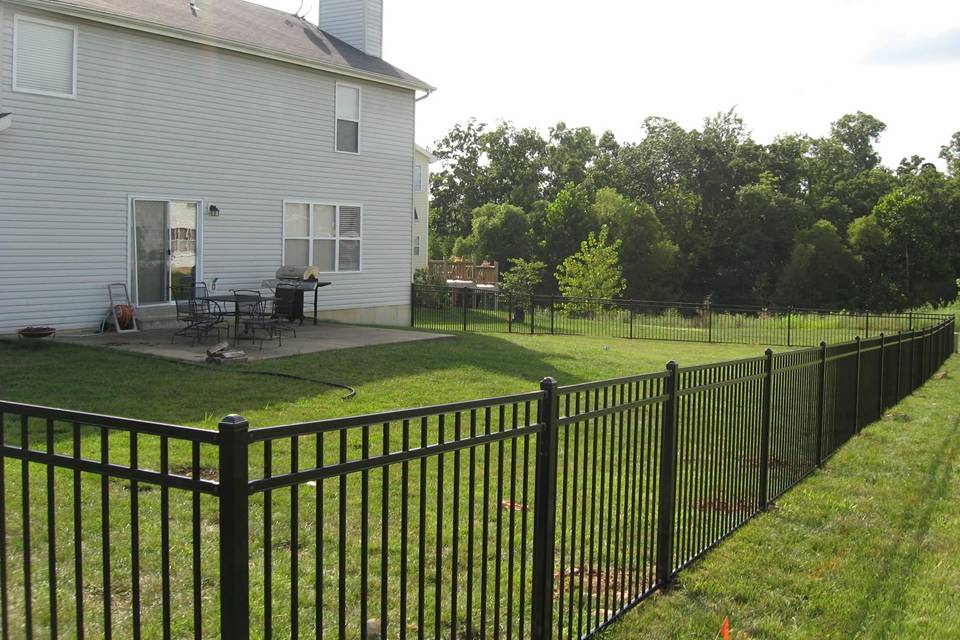 Steel fence is placed along the house yard.